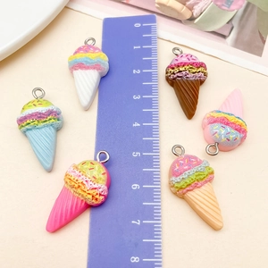 Detailed macro view showing six colorful resin ice cream pendants with size measurement