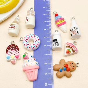 Cute resin dessert pendants including milk bottle and donut with ruler for scale