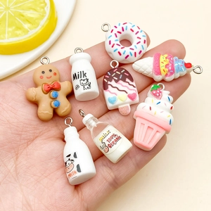 Detailed macro view of eight mini resin charms including donuts and milk bottles for DIY crafts