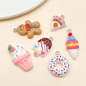 Assorted colorful resin dessert charms featuring gingerbread man and donuts for DIY crafts
