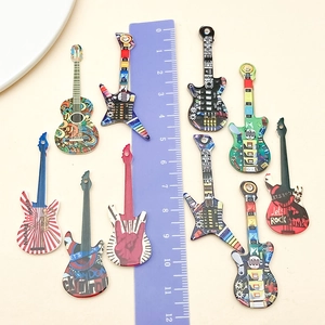 Detailed size view of acrylic guitar pendants with colorful prints and ruler measurement