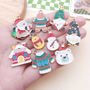 Macro view of Christmas enamel alloy pendants featuring Santa, reindeer and snowman shapes