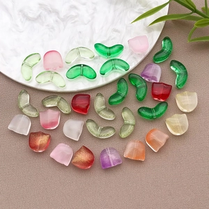 Macro detail of tulip-shaped glass beads with glossy, matte and glitter finishes for DIY