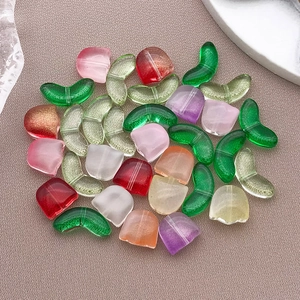 Close-up of colorful tulip-shaped glass beads for DIY jewelry and phone charms