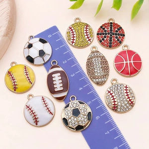 Macro view of assorted sports charms showing ball designs and rhinestone details