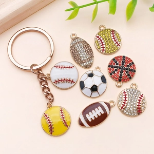 Detail view of sports charms with enamel finish and crystals on gold alloy base