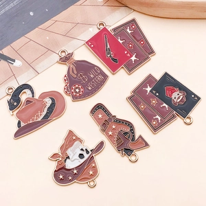 Detail of Wild West alloy charms featuring cowboy boots, skull, and vintage pistols