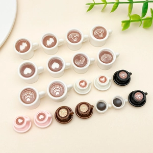 Collection of miniature resin coffee cup charms with latte art for DIY jewelry