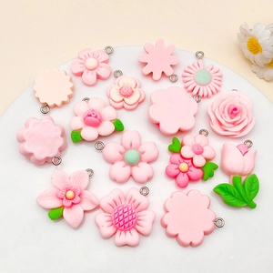 Pink resin flower pendants including roses and tulips for DIY jewelry crafting