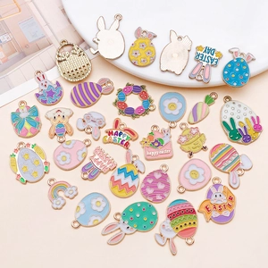 Colorful Easter bunny and egg enamel charms for DIY jewelry making on pink background