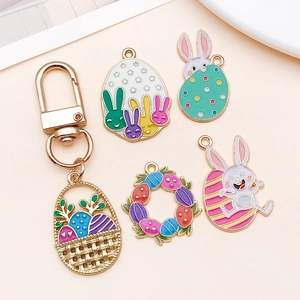 Detail view of colorful enamel Easter bunny and egg charms for DIY jewelry making