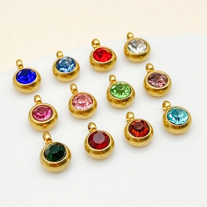 Set de 12 dijes redondos de piedras de nacimiento con engastes dorados y anillas de colgar