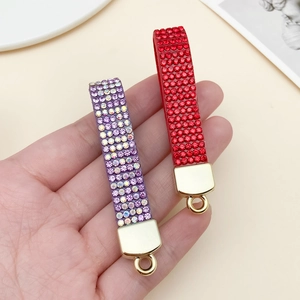 Sparkling rhinestone velvet keychains in purple and red with gold metal rings