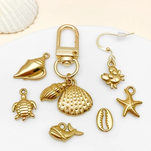 Gouden roestvrijstalen oceaanhangers set met zeeschildpad, zeester en krab vormige bedels