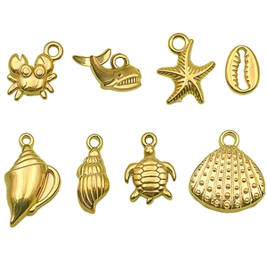 Acht gouden roestvrijstalen oceaan thema bedeltjes voor het maken van DIY sieraden