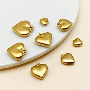 Polished gold heart pendants in various sizes for DIY jewelry making and earrings