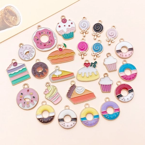Close-up of enamel dessert charms like donuts and cupcakes for DIY jewelry making