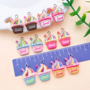 Detailed macro view of colorful resin ice cream charms with Sweet text and measuring ruler