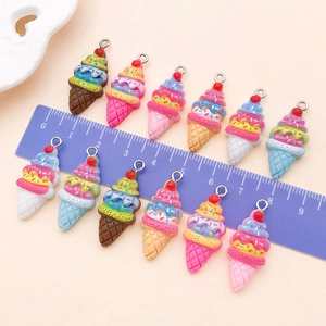 Detail showing colorful multi-layer resin strawberry ice cream cone charms for DIY jewelry