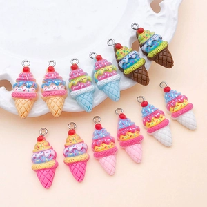 Macro shot of assorted resin strawberry ice cream cone pendants for DIY jewelry crafting