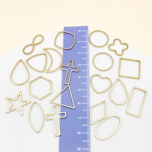 Golden stainless steel geometric DIY frame pendants with stars and crosses in 2-3cm size