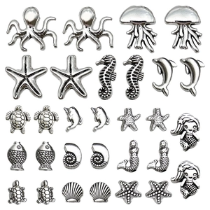 Set of antique silver ocean themed DIY jewelry charms with starfish and seahorse motifs