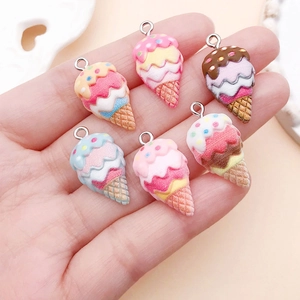 Detailed view of six colorful resin ice cream charms with metal loops for DIY jewelry making