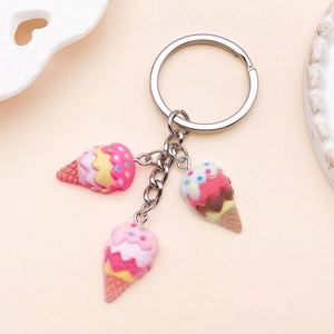 Close-up of resin ice cream pendants with metal keyrings for DIY jewelry making