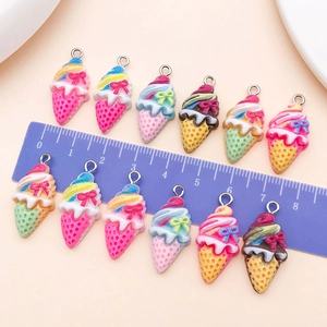 Detailed macro view of 2.5cm resin ice cream cone charms with textured bow detail