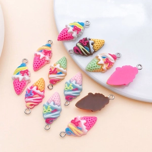 Close-up of resin ice cream cone pendants in various colors for DIY jewelry making
