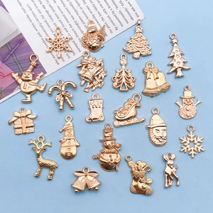Rose gold Christmas charms set with snowman, reindeer, and bells for DIY jewelry making