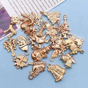 Collection of golden Christmas charms including reindeer and snowman with hanging loops