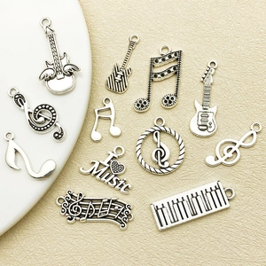 Antique silver musical instrument pendants featuring guitar and notes for DIY jewelry