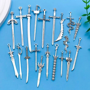 Set of 18 vintage silver alloy sword charms in various styles for DIY jewelry making