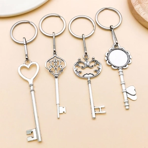 Set of four antique silver alloy keychains with vintage crown and heart patterns