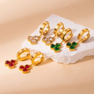 Three pairs of clover earrings with red, green, and clear crystals in 18K gold finish