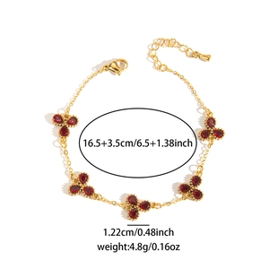 Dettagli bracciale dorato con pietre rosse a goccia, lunghezza sedici virgola cinque cm
