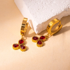 Elegant 18K gold plated stainless steel clover earrings with red zircon stones on stone base
