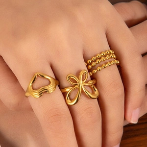 Three-piece set of gold irregular rings with butterfly and heart cut-outs for women