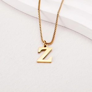 Detailed view of a gold-plated titanium steel square link chain with a letter Z pendant
