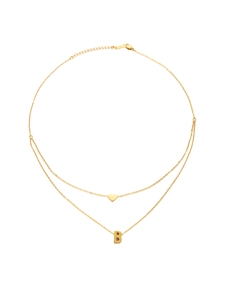 Close-up of gold double-layer necklace with heart and letter B pendants on steel