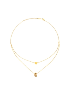 Close-up of gold-plated stainless steel double-layer necklace with heart and G pendants