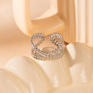 Macro shot of silver adjustable crisscross ring with pavé set cubic zirconia