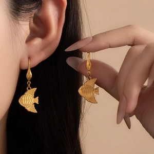 Gold-plated titanium fish dangle earrings featuring a detailed ocean-inspired design