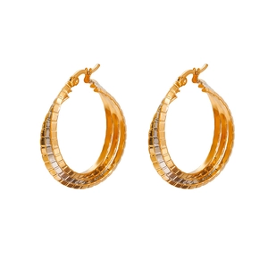 Classic two-tone oval hoop earrings with gold-silver plating and engraved texture
