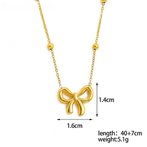 Detailed view of golden bow necklace with O-chain and beads, measuring 1.6cm wide