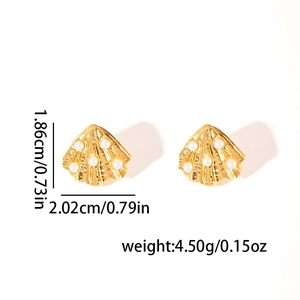 Golden irregular shell stud earrings with white pearls on a minimalist white background