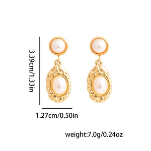 Detail view of pearl drop earrings with gold textured metal frames and dimensions