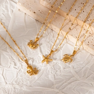 Minimalist gold stainless steel ocean series necklaces with crab and starfish pendants