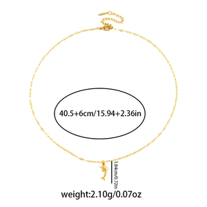 Detail view of gold crab pendant necklace with adjustable chain length measurements